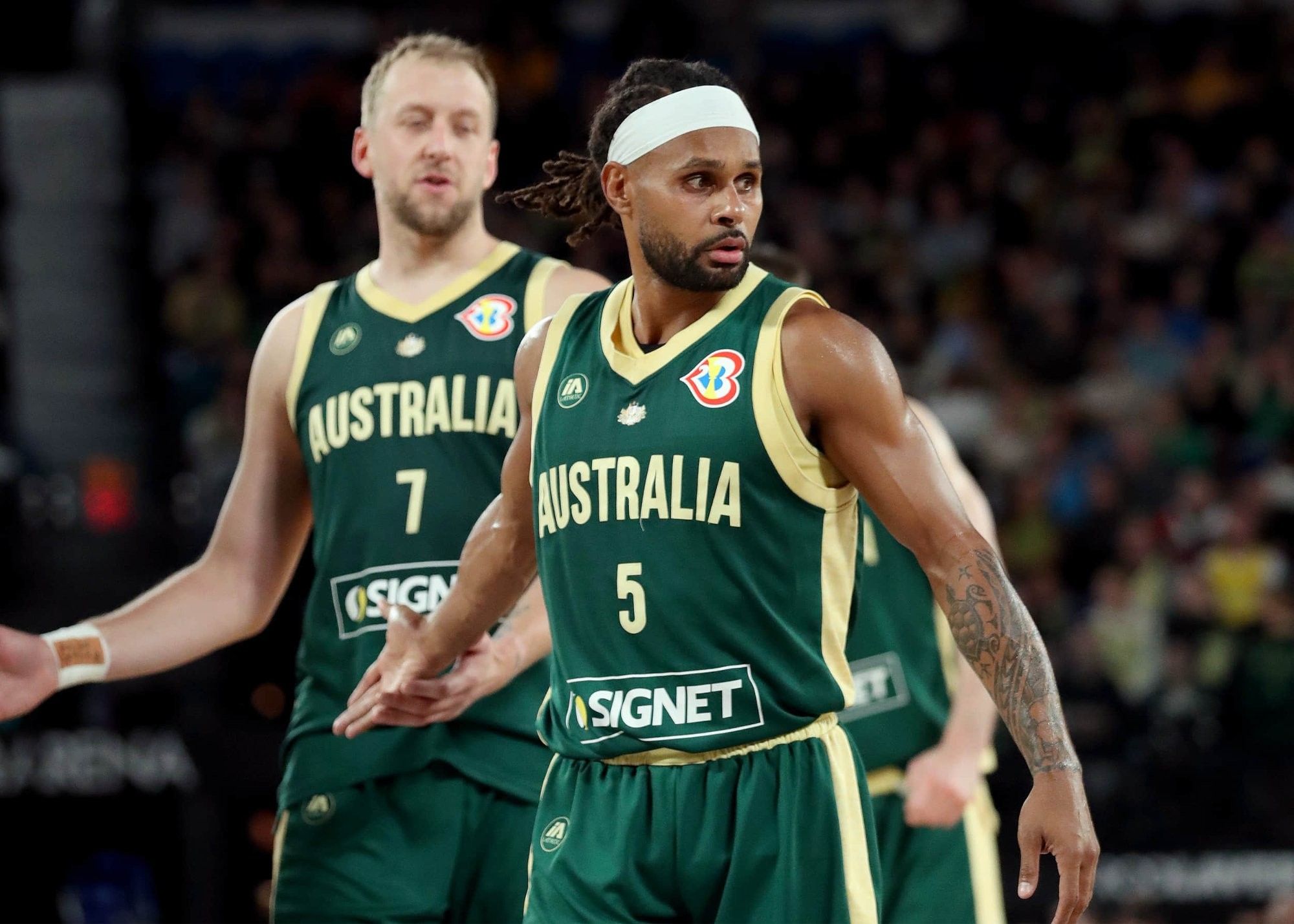 Micic misses one of two free throws; Mills sinks a clutch jump shot to tie the score—Australia & Serbia head to overtime.